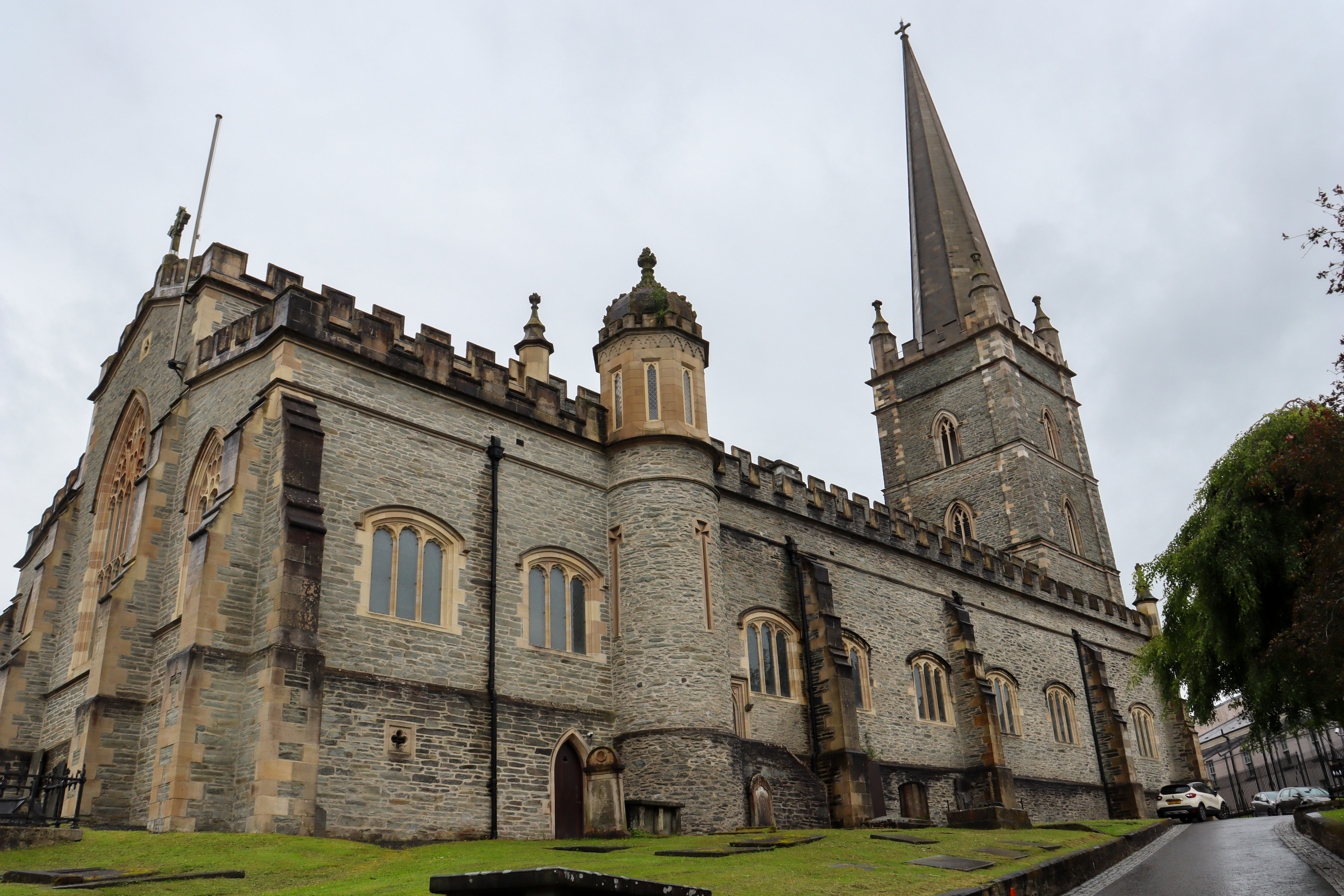 Cathedral on a hill with very old graves around it.