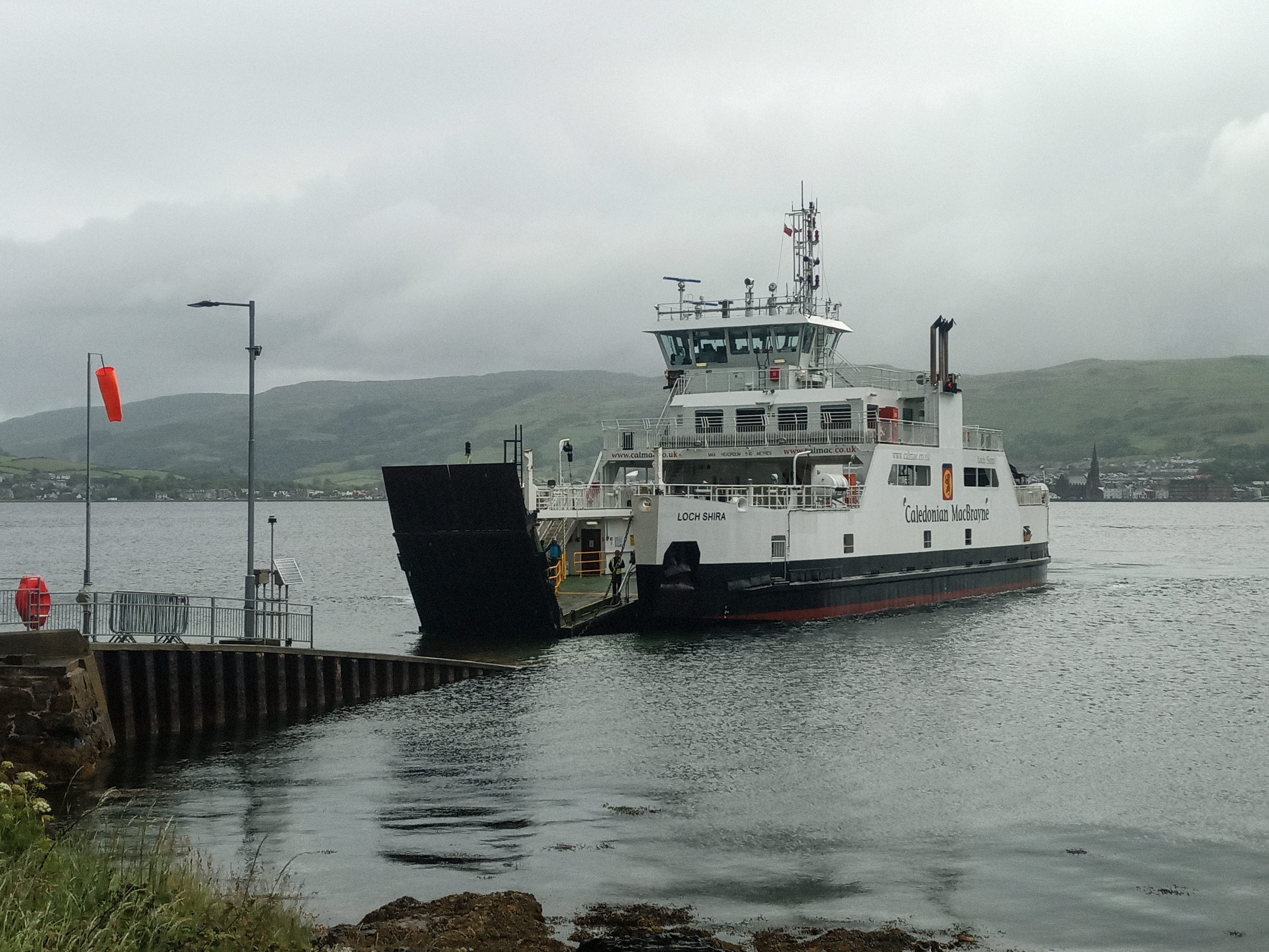 Small ferry arriving at slipway with its door part open