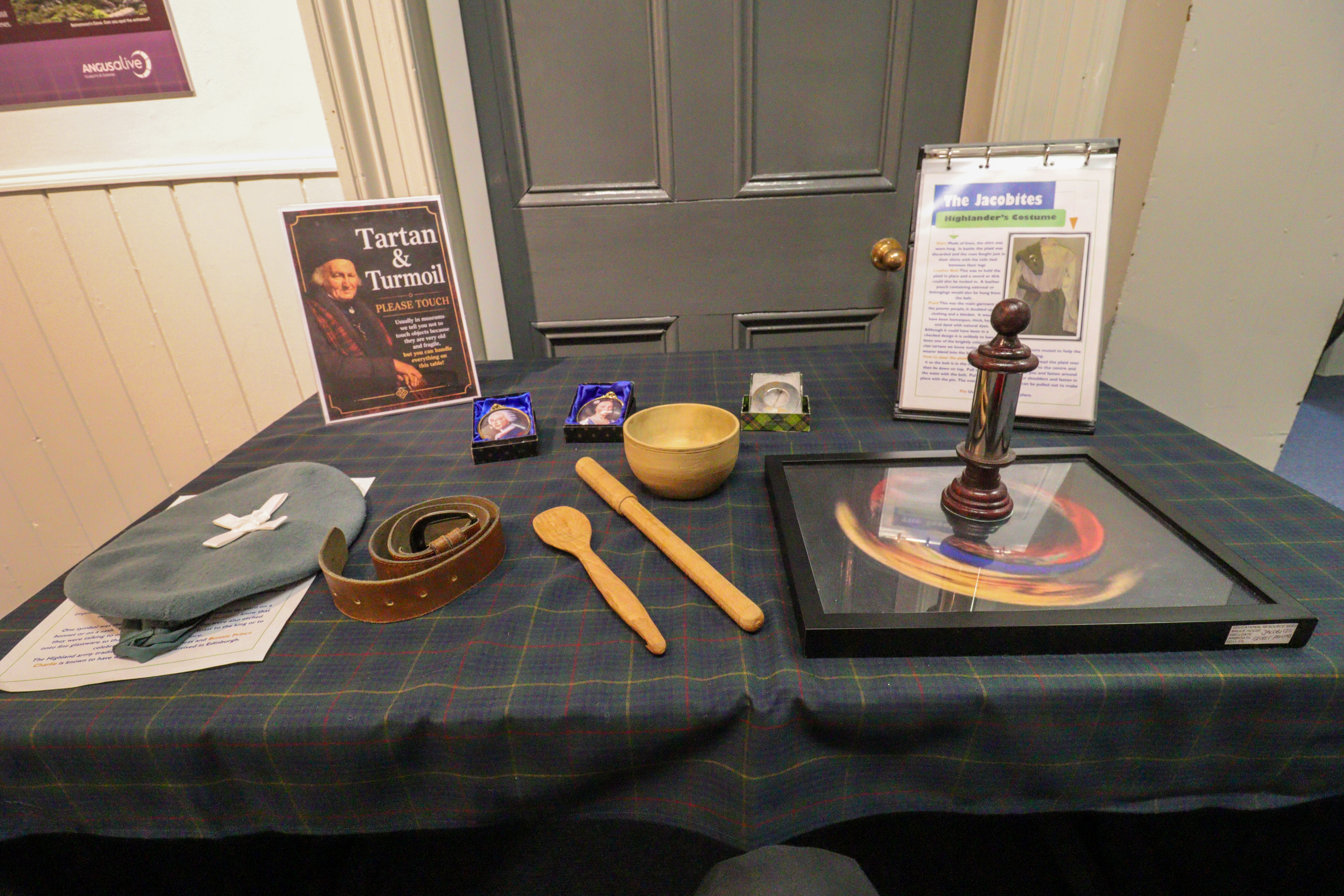 Table with Jacobean artefacts that you can pick up and touch