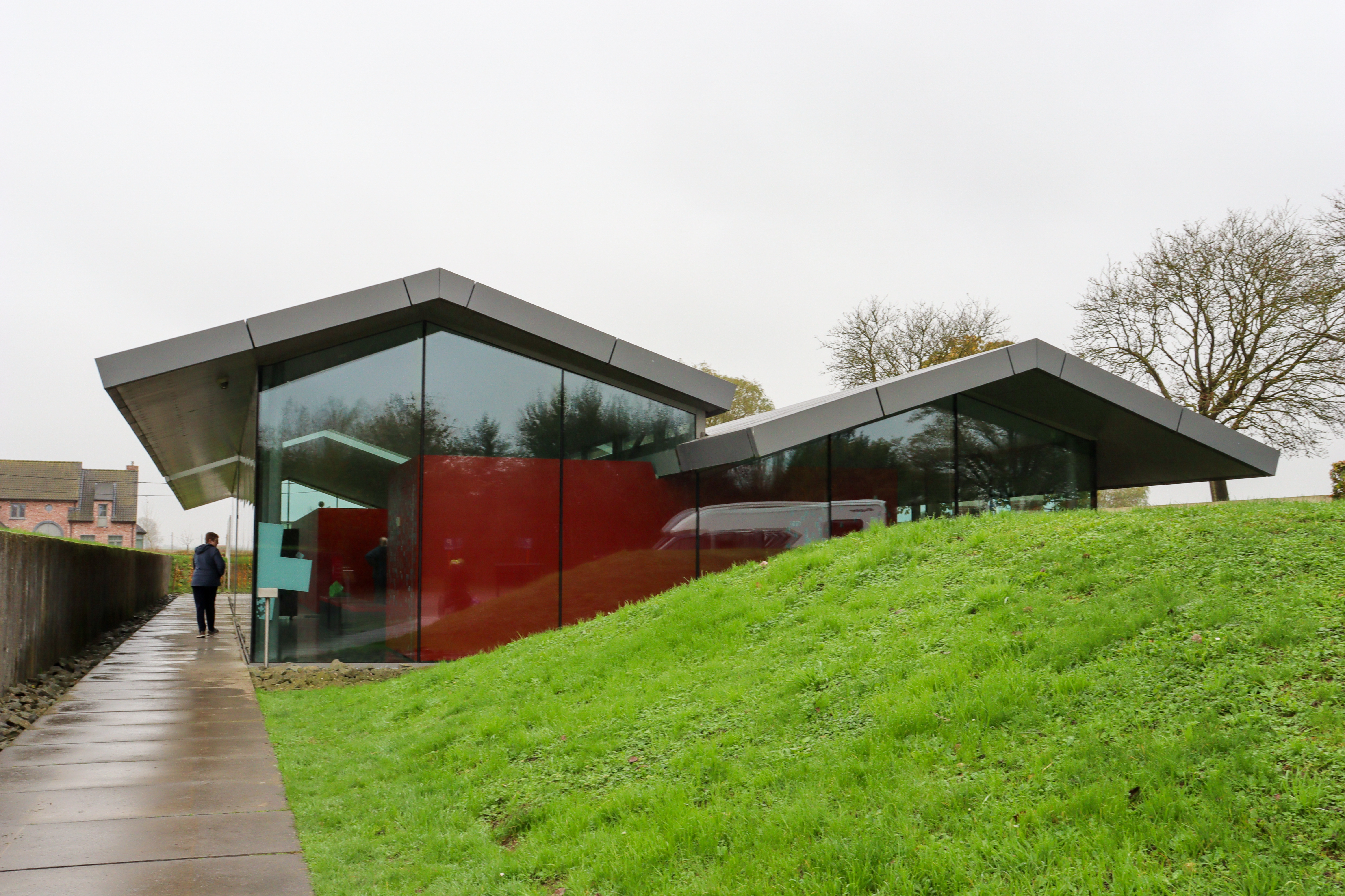 Visitor centre is a single story glass building with good path to it