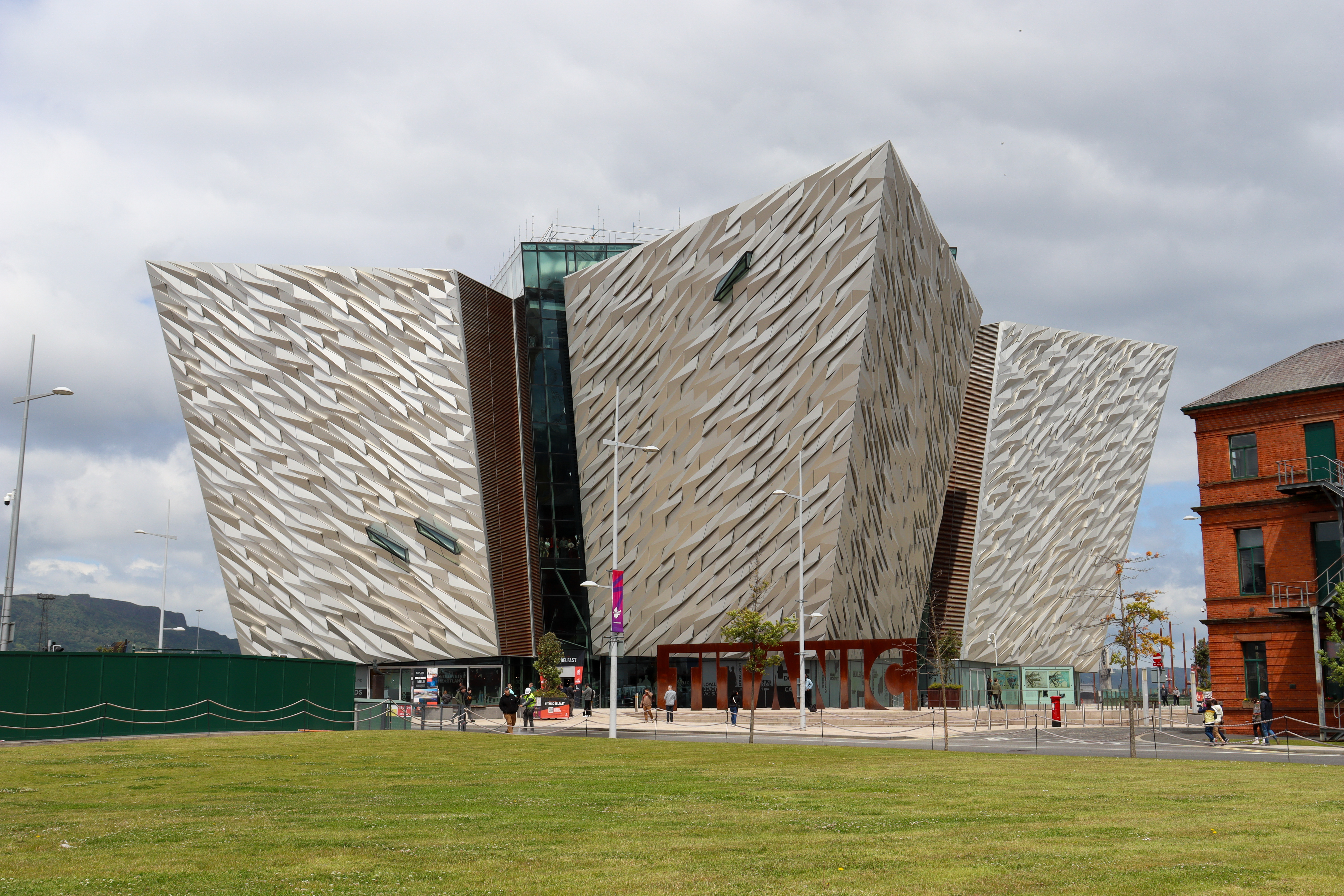 Large building in the shape of four ship hulls, each facing a different compass direction.