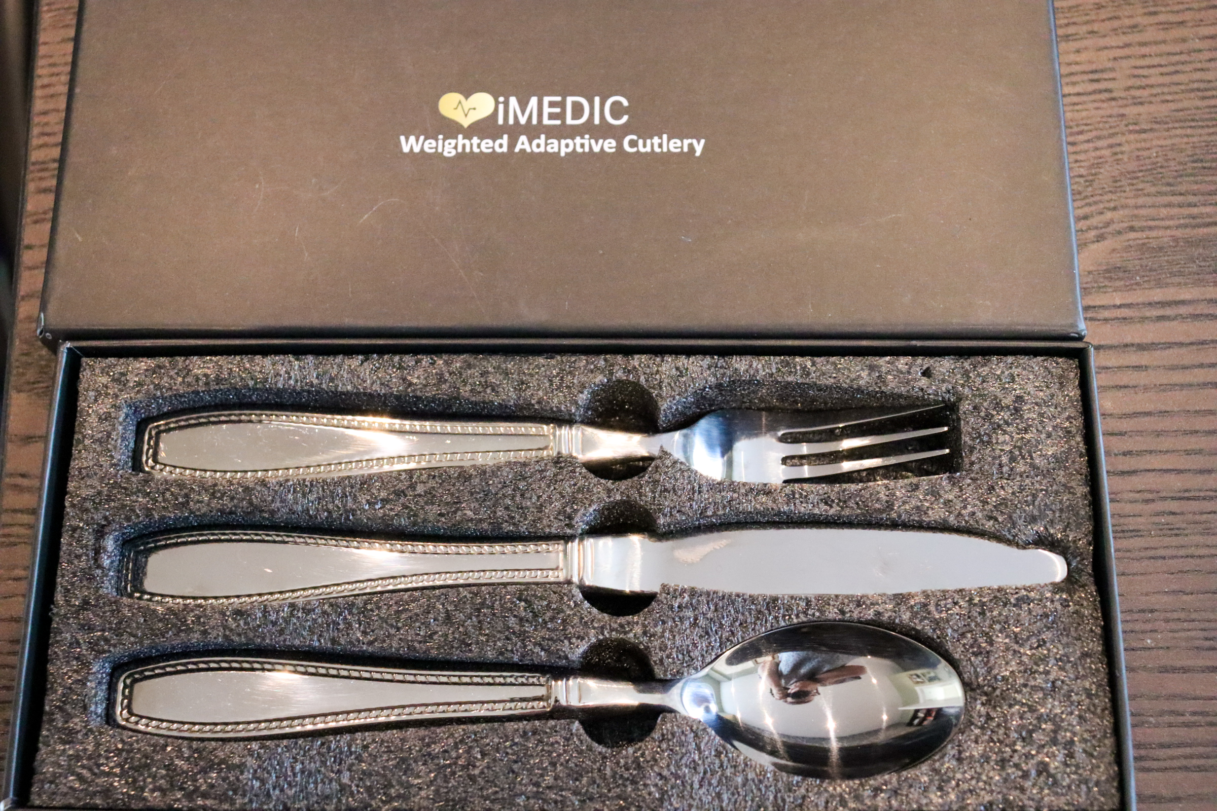 Knife, fork and spoon in a solid presentation box with lid