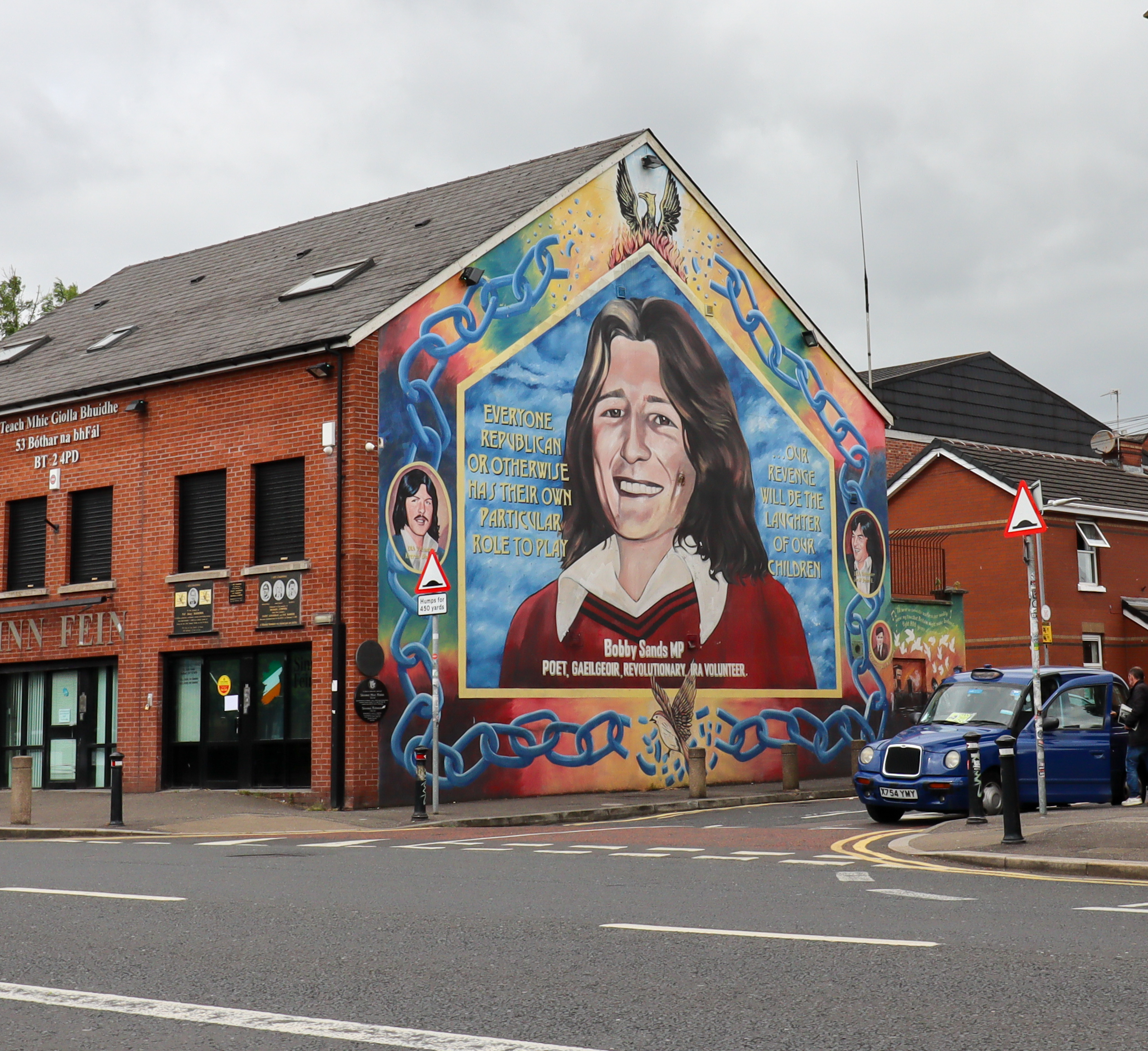 Large mural of Bobby Sands MP: poet, gaolgoer, revolutionary, IRA volunteer.